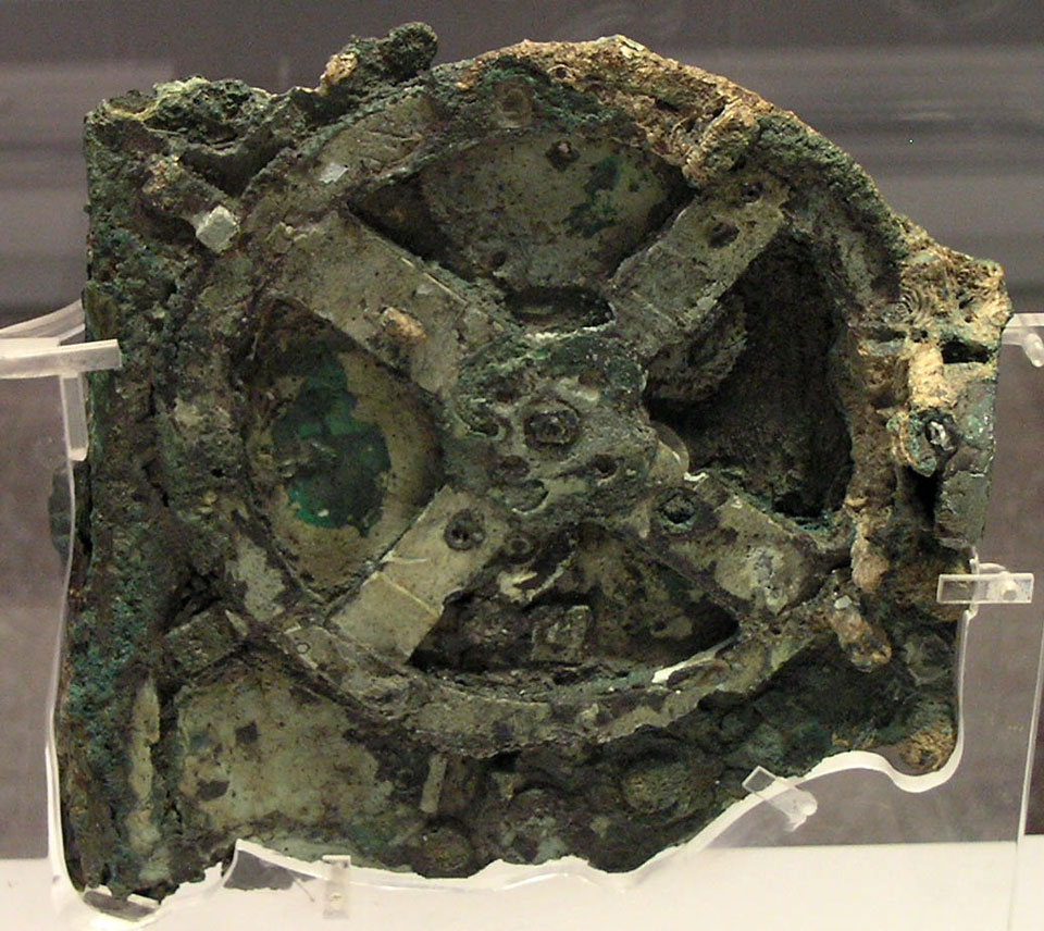 The ancient Antikythera mechanism is shown, the oldest known orrery. See Explanation.