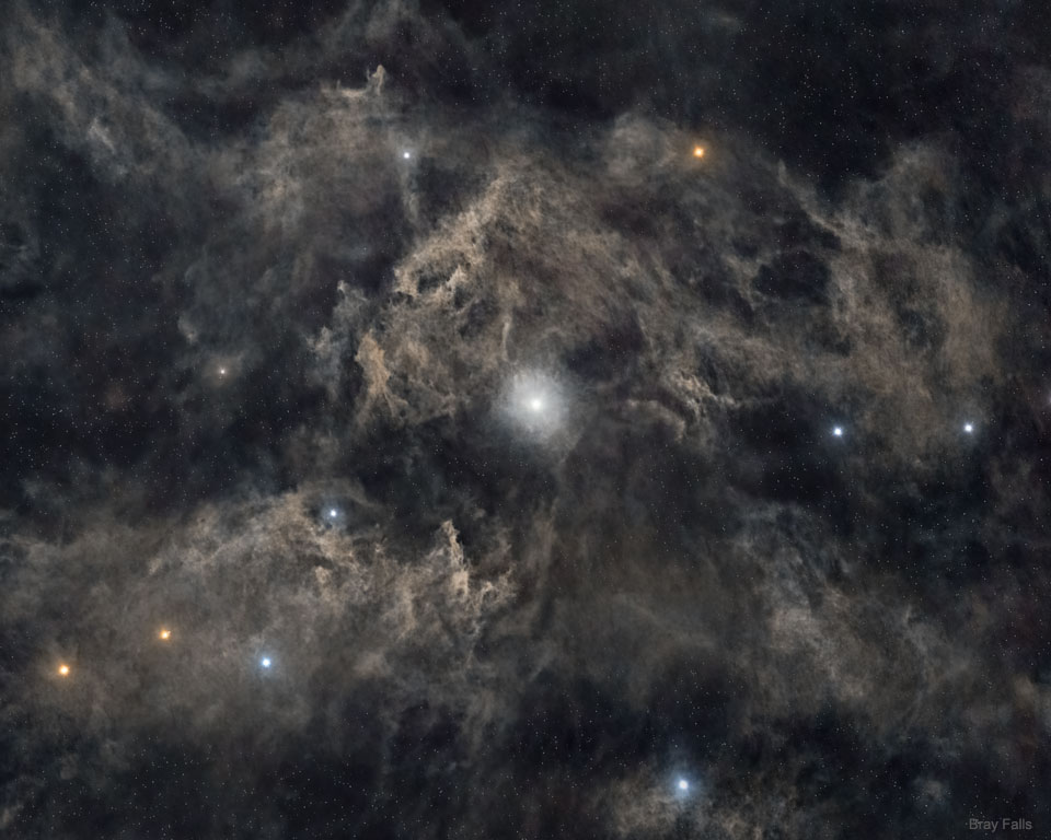 A picture of the the star Polaris surrounded by gas clouds and other stars.
Please see the explanation for more detailed information.