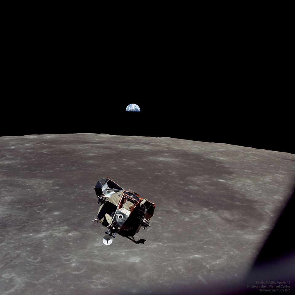 A picture of the Apollo 11 spaceship Eagle returning from the Moon's surface
with Earth in the background. 
Please see the explanation for more detailed information.