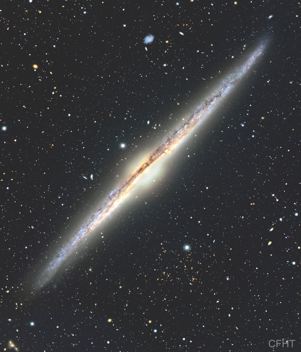 A picture of edge-on spiral galaxy NGC 4565.
Please see the explanation for more detailed information.