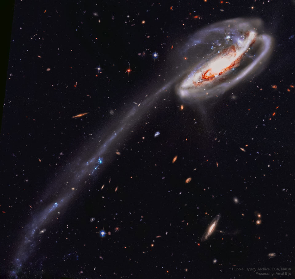 The picture shows the Arp 188, the unusual Tadpole Galaxy with a long star-filled
tail as captured by the Hubble Space Telescope.  
Please see the explanation for more detailed information.