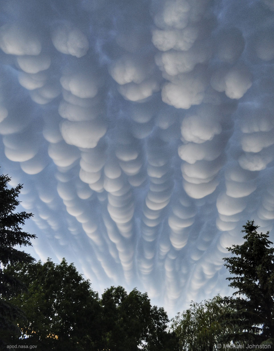 The picture shows a rows of mammatus clouds photographed
over Saskatchewan, Canada. 
Please see the explanation for more detailed information.
