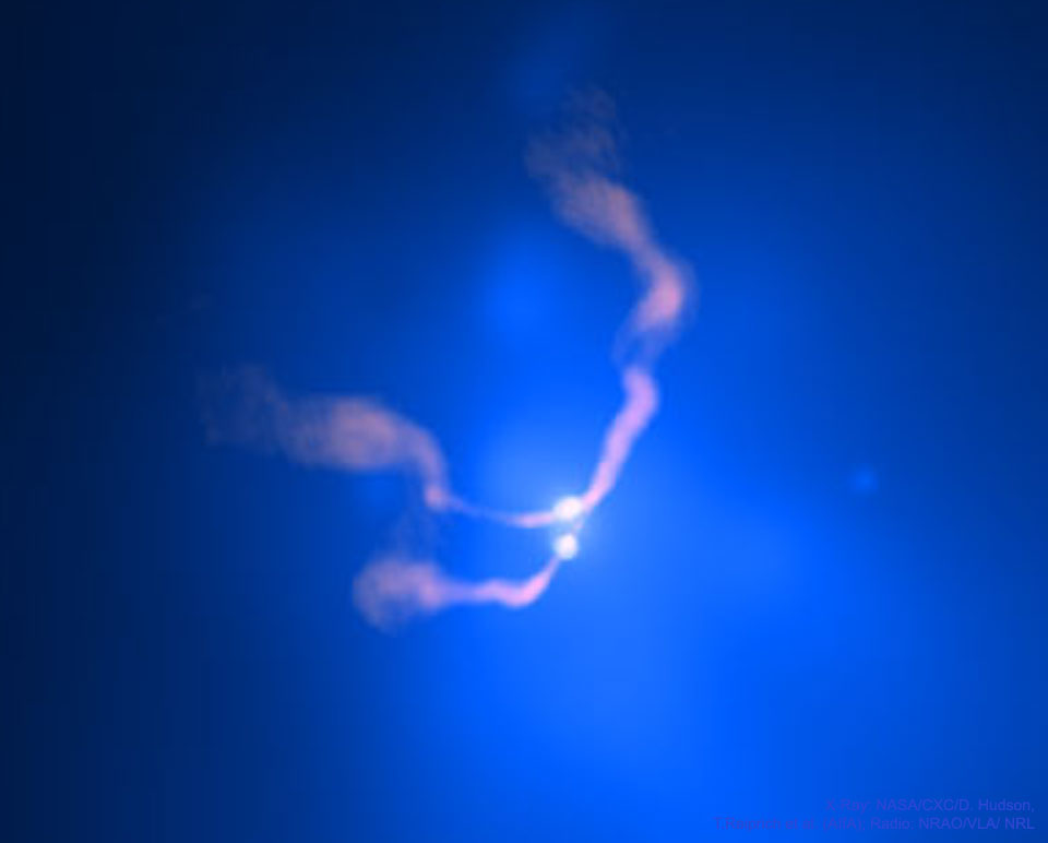 The featured image shows two bright sources near 
the center of a nearby galaxy. The object is called 
3C 75. The two bright sources are thought to be two
black holes slowly spiraling together. 
exhaust makes the Sun's outline appear to ripple.
Please see the explanation for more detailed information.