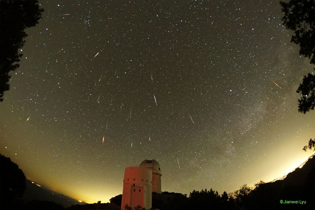 The featured image shows meteors from the usual docile
Tau Herculids meteor shower. The image records 19 images from the 
shower, with 3 other meteors also captured. In the foreground are
two telescopes from Kitt Peak: the 2.3-meter Bok telescope and the
4-meter Mayall telescope.
Please see the explanation for more detailed information.
