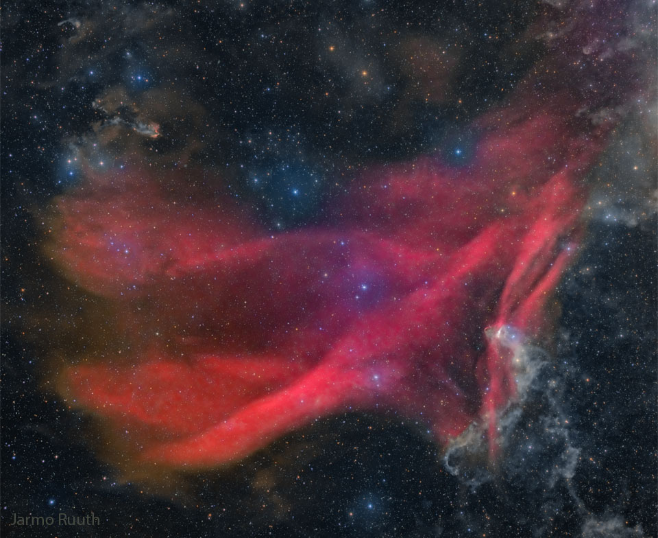 The featured image shows stars and the glowing red
waves of the Great Lacerta Nebula. 
Please see the explanation for more detailed information.