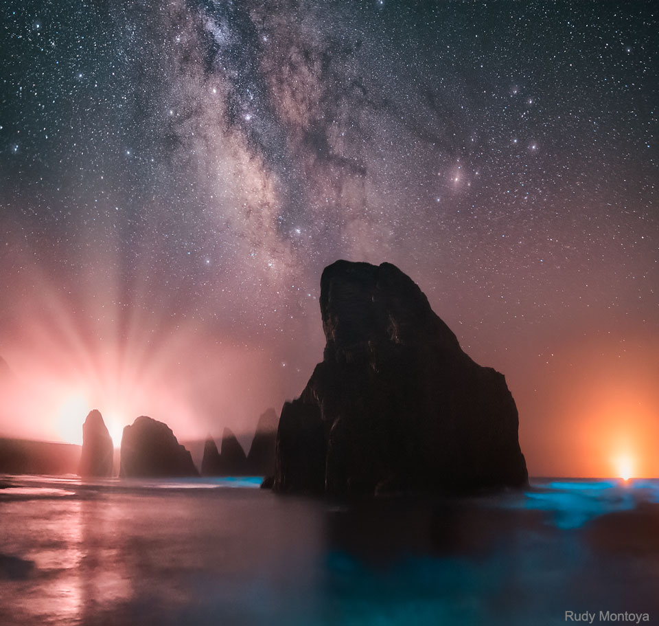 The featured image shows rock outcrops off the coast of
Oregon, USA, with blue bioluminescence in the water and the central
band of our Milky Way galaxy in the sky.
Please see the explanation for more detailed information.