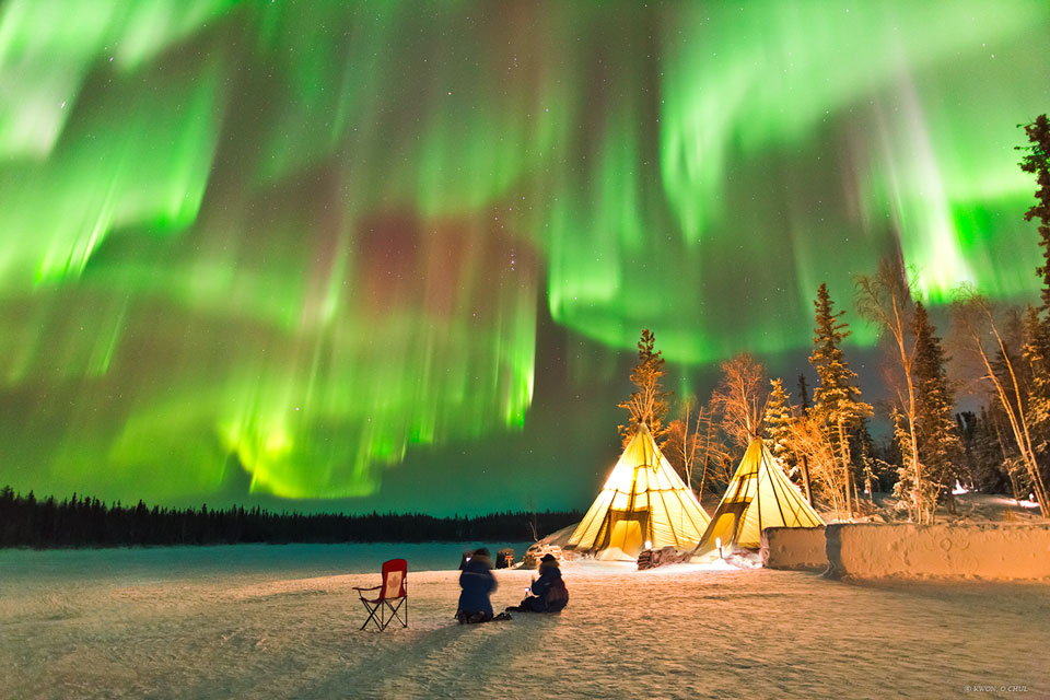 The featured image tipis below a night sky lit up
with multiple green auroras.
Please see the explanation for more detailed information.