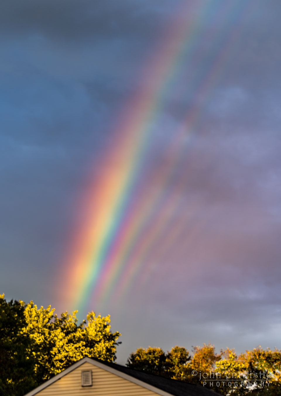 The featured image shows many parallel rainbow bands over 
a house with trees.
Please see the explanation for more detailed information.