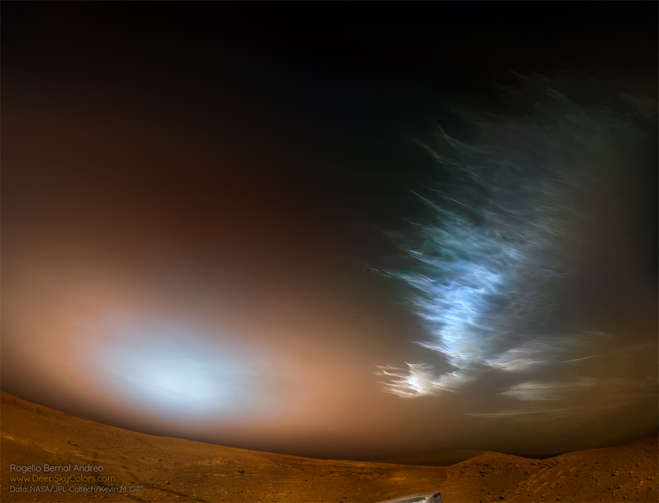 Ice clouds are seen over the surface of Mars on the upper
right. Toward the lower left is a bright spot in the sky which
is likely the Sun setting through Martian dust. 
Please see the explanation for more detailed information.