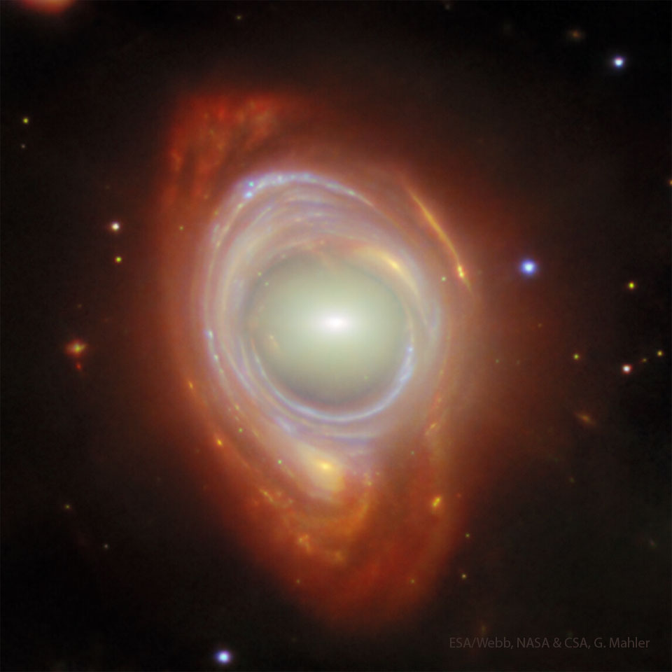 What looks like a single spiral galaxy is shown with a 
white center surrounded by inner blue arms and outer 
red arms. 
Please see the explanation for more detailed information.