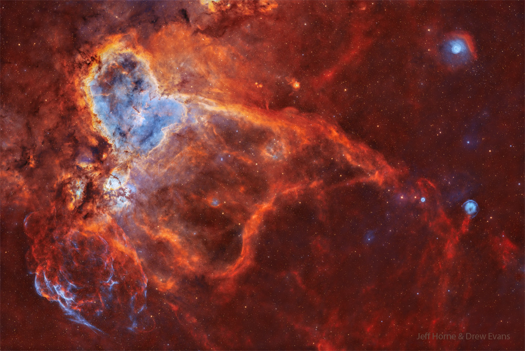 A wide star field is shown with several nebulae as identified by
the rollover image. On the upper left is a large nebula named 
the Heart Nebula. 
Please see the explanation for more detailed information.