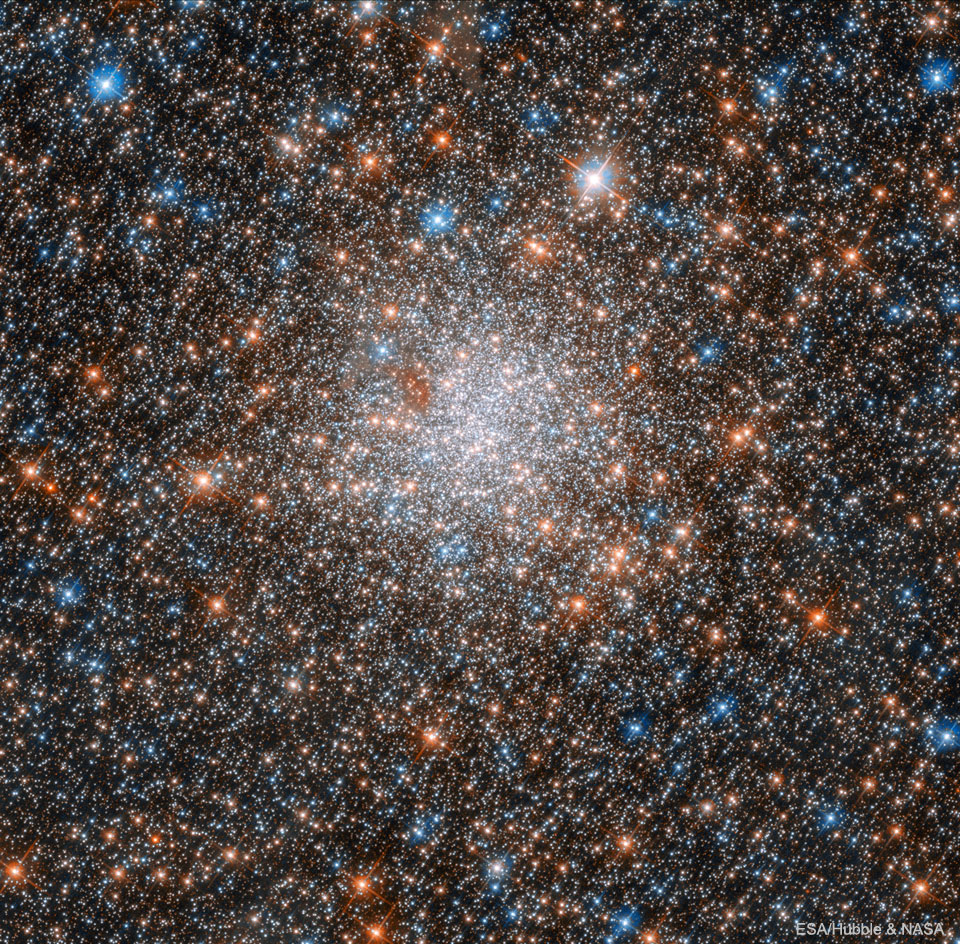 The ball of colorful stars is shown where the center
is so dense with stars it is hard to identify individual stars.
Please see the explanation for more detailed information.